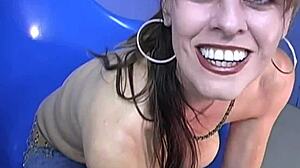 Angel, a busty cougar, enjoys a BBC in a gloryhole setting
