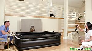 brunette masseuse gives naked nuru massage.