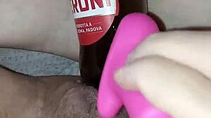 Gretala, pregnant and excited, rubs the bottle on her juicy pussy lips