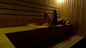 Hidden Camera Catches a Girl Fingering Herself in a Sauna at Night