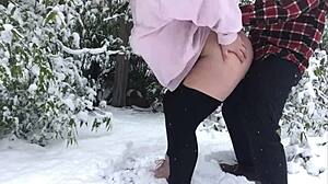 An older couple enjoys a snowy outdoor adventure together