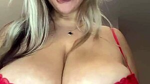 milf's big natural saggy tits straining her bra as she moves around the house