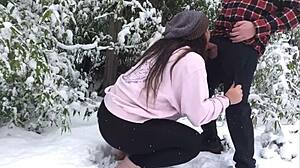 An older couple enjoys a snowy outdoor adventure together