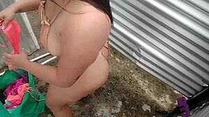 New amateur video with a woman in a dressing room in public