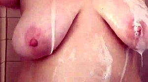 Curvy BBW mama tantalizes in shower, washing hair and shaving her natural big tits