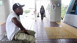 A pregnant woman gives a blowjob to a black man in public