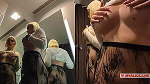 Spy on busty girl in changing room with transparent clothes.
