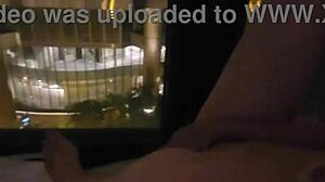 Masturbating in public in front of hotel window