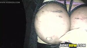 Big tits are slapped and fucked in a garage BDSM scene
