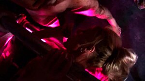 Olga Cabaeva bent over in fishnets for deepthroat and fingering by big tits mommy in crowded room