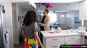 Stepdaughter kneels to blow her stepdad in a sneaky family moment.