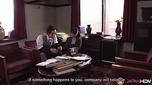 Japanese office lady Nana Kunimi casually sucks cock at work.