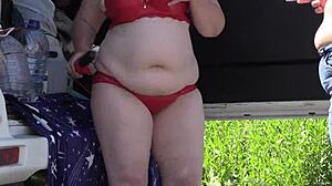 mature women behind the scenes outdoors. a voyeur with hidden camera watches in the park