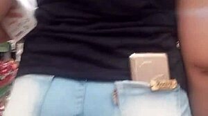 spying on the hot brunette ass in jeans at the shop