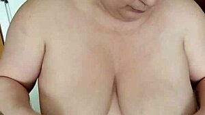 Playing with big tits.