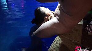 Asian beauty gets fucked in the pool and receives a load of cum