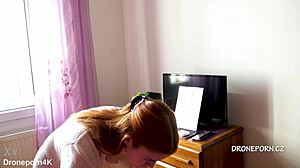 Karolinka, the cute Czech redhead, applies makeup naked