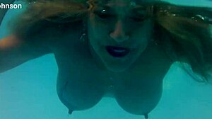 MELISSA THE MERMAID SWIMS IN POOL WITH TATTOOS BROWN EYES