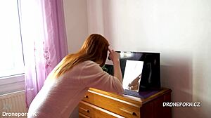 Karolinka, the cute Czech redhead, applies makeup naked