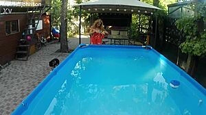 MELISSA THE MERMAID SWIMS IN POOL WITH TATTOOS BROWN EYES