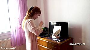 Karolinka, the cute Czech redhead, applies makeup naked