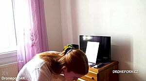 Karolinka, the cute Czech redhead, applies makeup naked