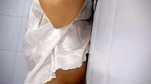 A chubby woman gets excited by playing with her tits