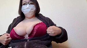 a married japanese woman couldn't resist rubbing her big breasts while masturbating in full video