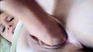 she uses the large thick dildo to fuck her pussy, clothes ripping as it gets dripping wet