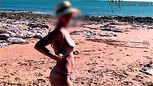 A wifey is flashing her tits on the beach
