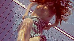 Sexy petite 18+ Russian teen Libuse shows small tits by pool