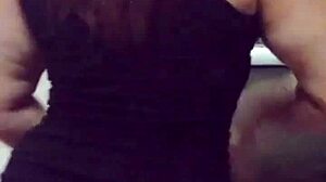 The mature prostitute with a big ass shows off her marked panties while teasing her clients