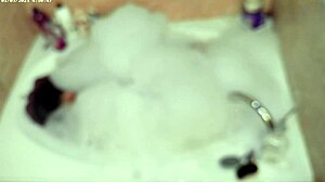 Boy enjoys solo bubble bath in bathroom