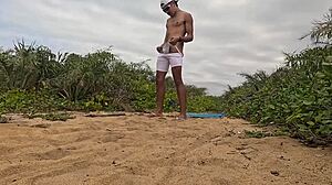 African Guy Jerks Off And Cums On The Beach!