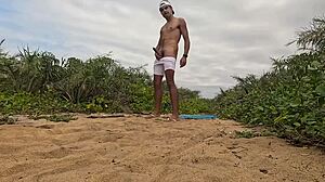 African Guy Jerks Off And Cums On The Beach!
