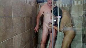 Hot sexy babe shaves in shower, giving jerk off instructions with big natural tits close up.