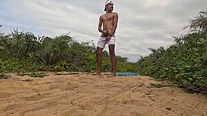 African Guy Jerks Off And Cums On The Beach!