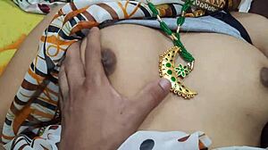 Indian sexy aunty in sari shows big boobs and ass for rough chudai. Her curves drive wild action