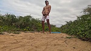 African Guy Jerks Off And Cums On The Beach!