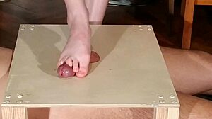 Domina stomps cock with bare feet