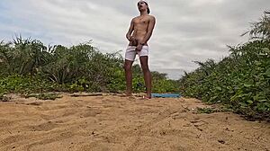 African Guy Jerks Off And Cums On The Beach!