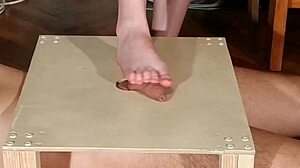 Domina stomps cock with bare feet