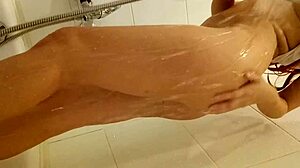 redhead teen 18+ relaxes in the bath with tattoos