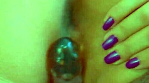 Watch desi beauty use glass dildo up close.