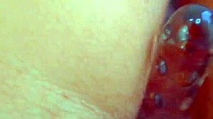 Watch desi beauty use glass dildo up close.