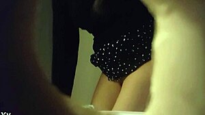 Hidden cam catches babe peeing in white panties through wall hole