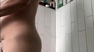 Milf with tattoo masturbates in shower, focusing on wet tits, big clit, ass, and pussy