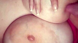 Amateur sucks her big natural tits