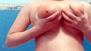 A hidden cam catches a cute wife masturbating in the bathroom, her big tits bouncing on webcam