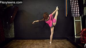 Hot teen flexible model stretches naked in gym